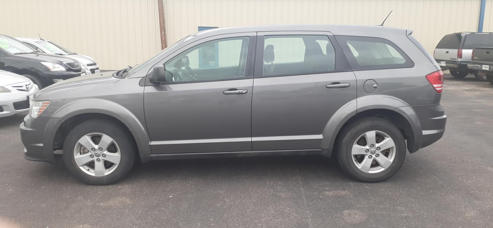 2013 Dodge Journey SE (3C4PDCAB0DT) with an 2.4L L4 DOHC 16V engine, 4-Speed Automatic transmission, located at 2015 Cambell Street, Rapid City, SD, 57701, (605) 342-8326, 44.066433, -103.191772 - CARFAX AVAILABLE - Photo#0